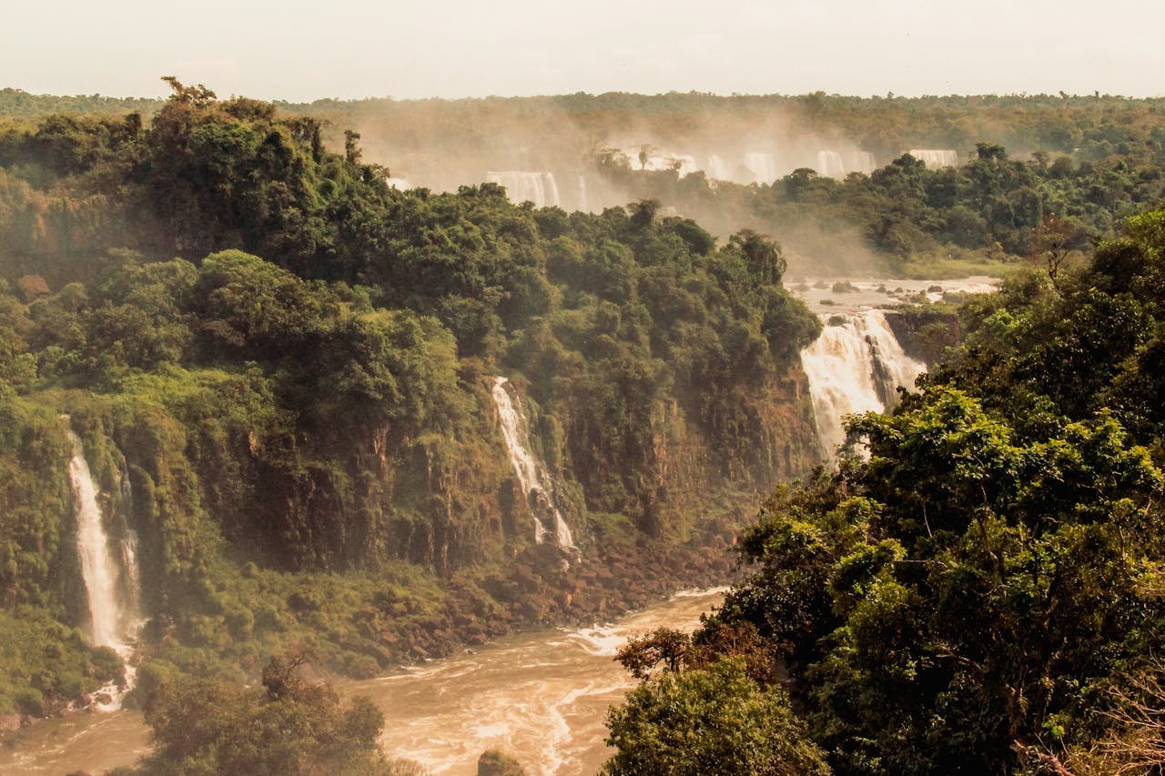 Majestic view of Iguazu Falls set in lush Brazilian rainforest.